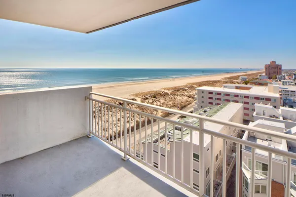a view of a water heater room with wooden floor