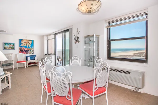 a dining room with furniture and window