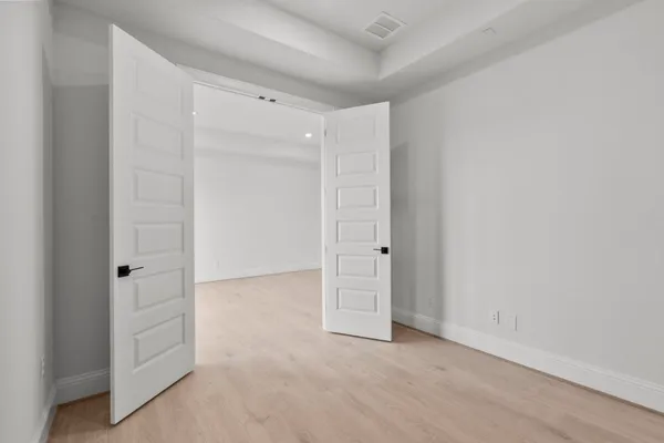 an empty room with closet area
