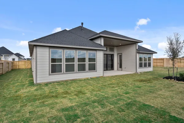 a house with yard in front of it