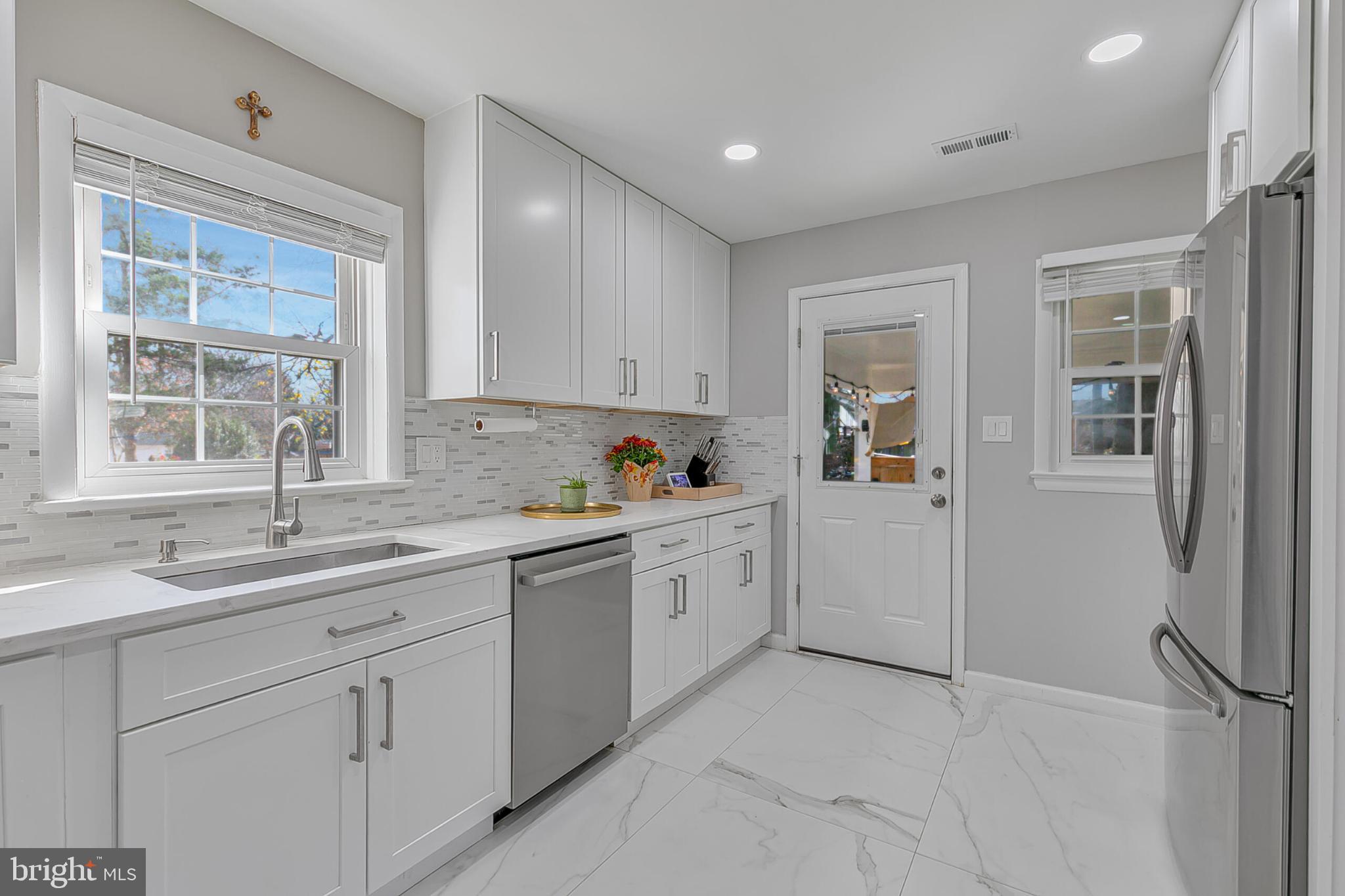 3419 Ramsgate Terrace Alexandria, VA 22309 - Photo 12 of 36 Bright and modern kitchen with sleek finishes.