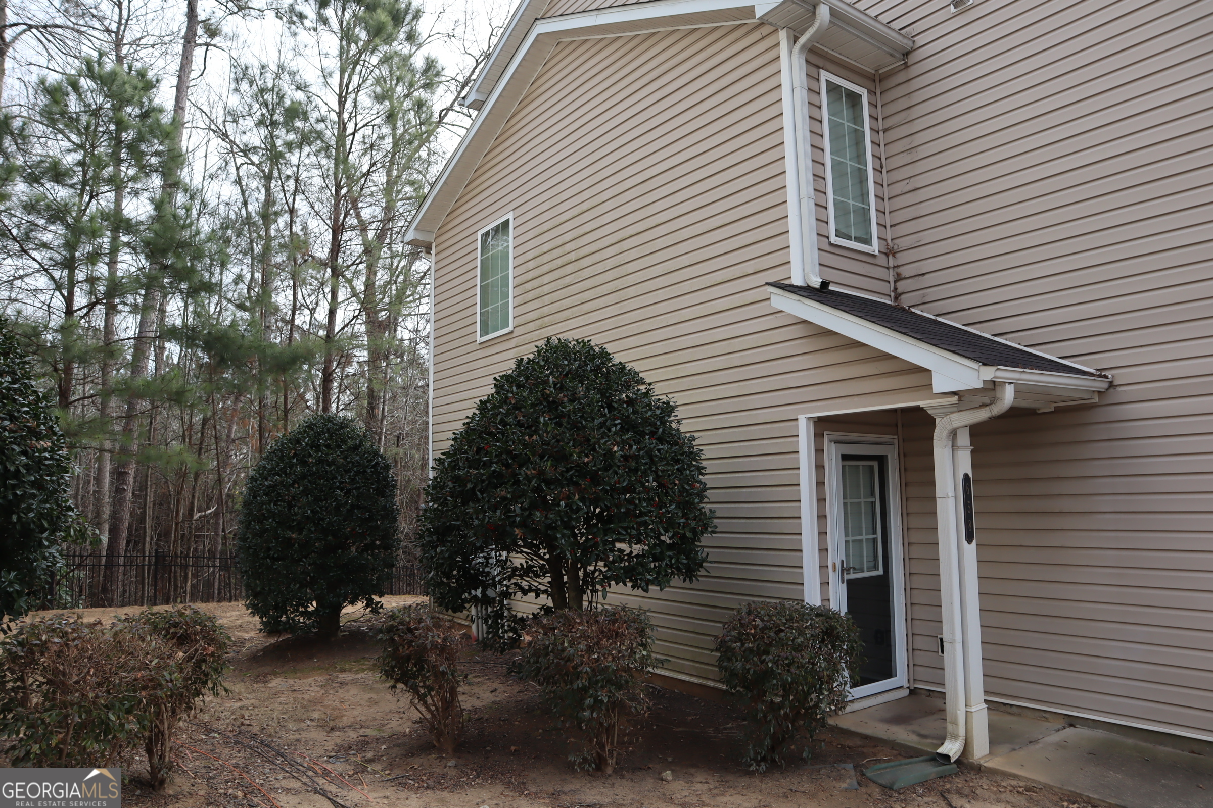 658 Providence Place Southwest Atlanta, GA 30331 - Photo 4 of 5 a view of backyard with plants and a large tree