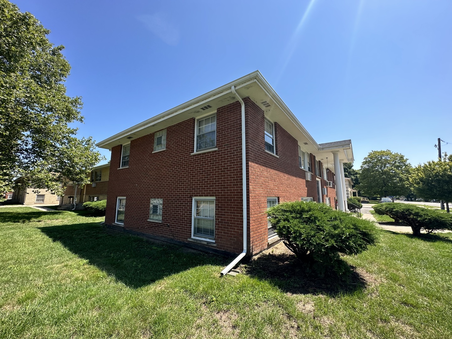 1585 West Station Street Kankakee, IL 60901 - Photo 4 of 12 a view of a house with a yard