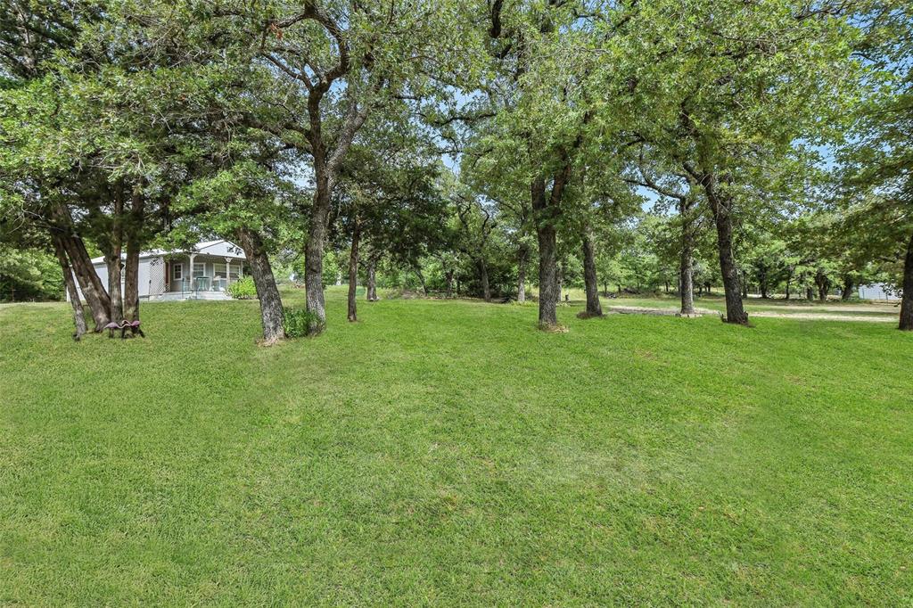 454 Bear Ridge Road Bowie, TX 76230 - Photo 25 of 36 View of green lawn