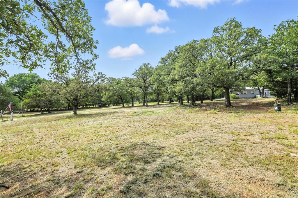 454 Bear Ridge Road Bowie, TX 76230 - Photo 27 of 36 View of yard with a view of countryside