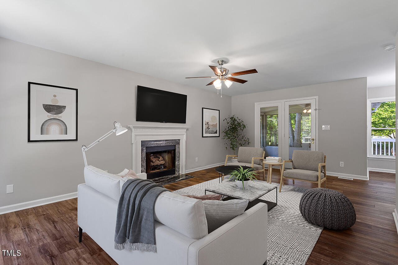 8 Warbler Lane Durham, NC 27712 - Photo 12 of 36 a living room with furniture fireplace and a flat screen tv