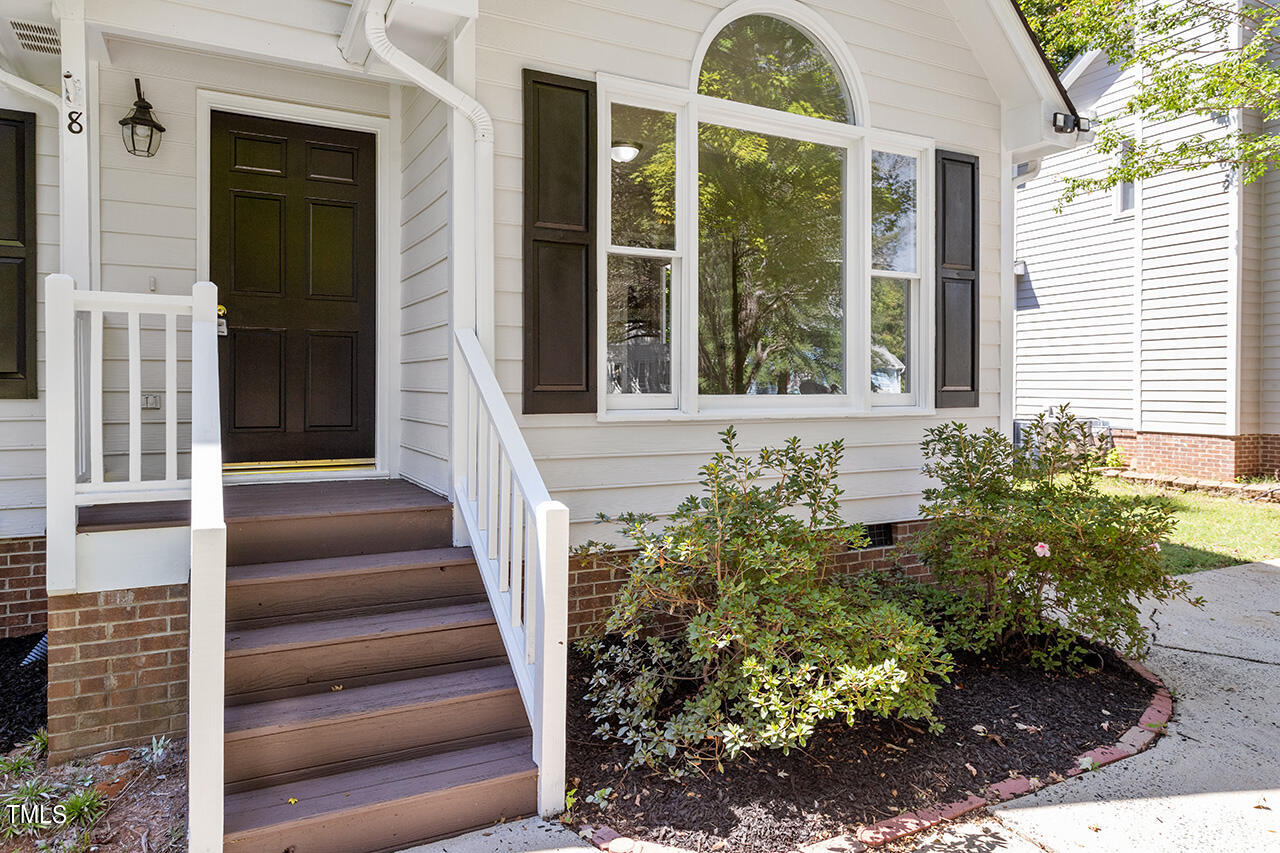8 Warbler Lane Durham, NC 27712 - Photo 2 of 36 a front view of a house with a garden