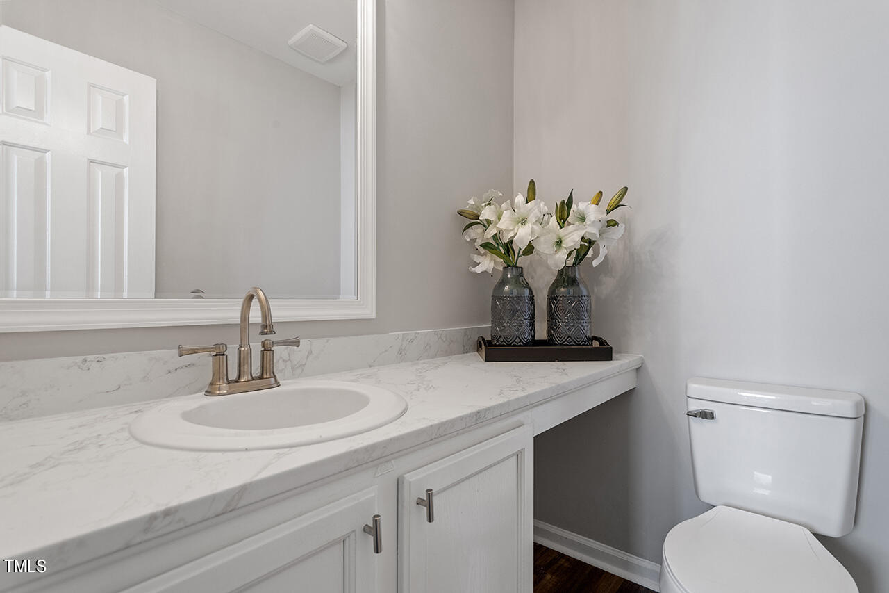 8 Warbler Lane Durham, NC 27712 - Photo 27 of 36 a bathroom with a sink toilet and a mirror