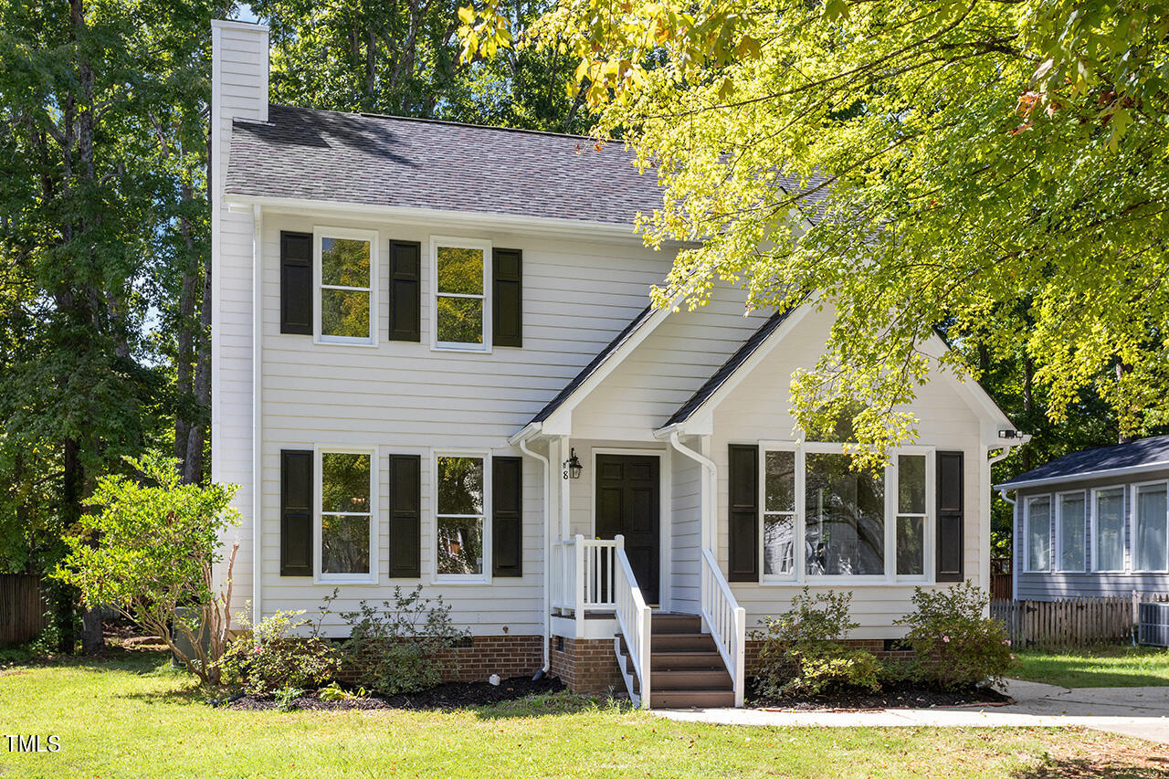 8 Warbler Lane Durham, NC 27712 - Photo 3 of 36 a front view of a house with a yard and garage