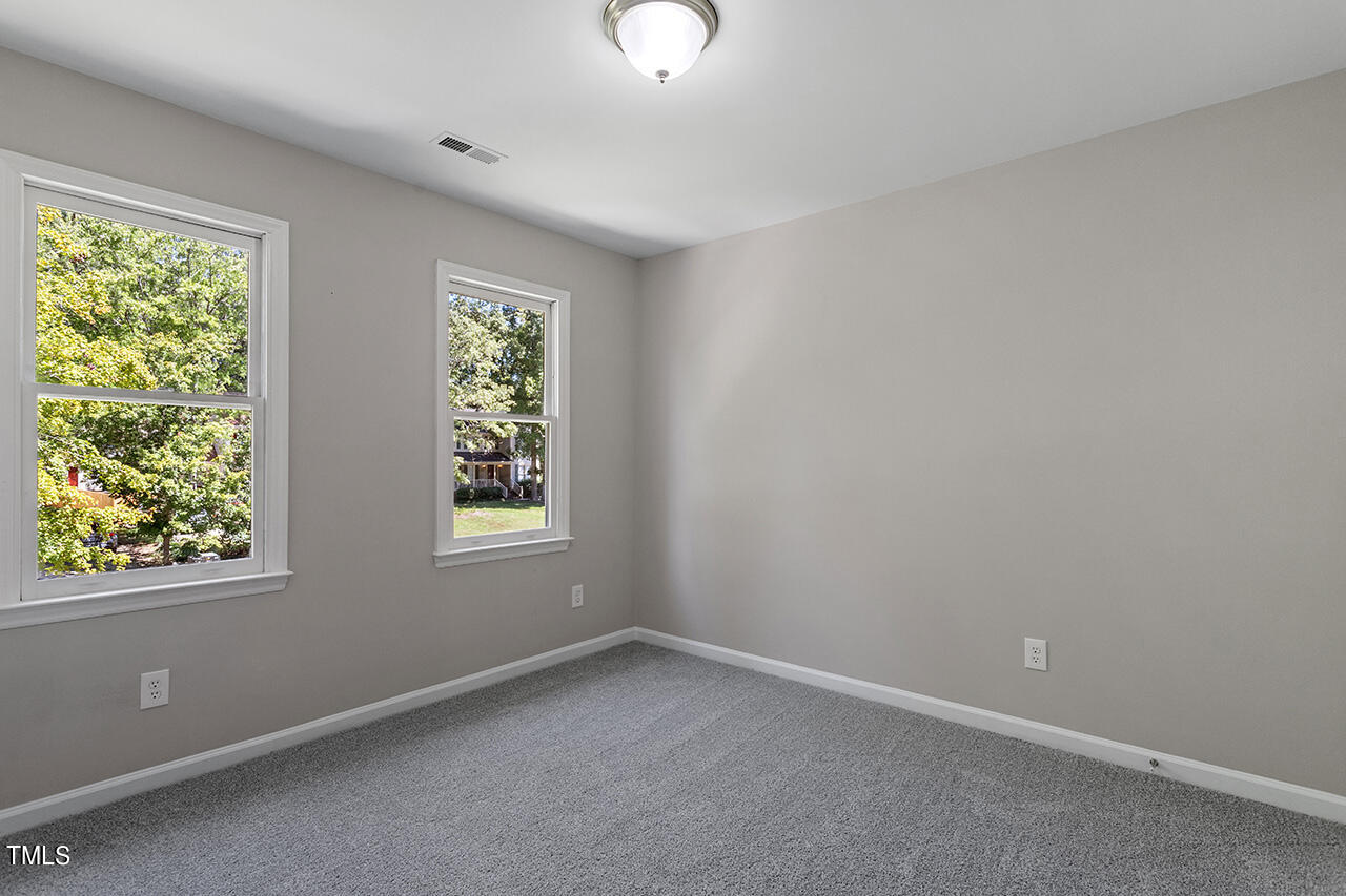 8 Warbler Lane Durham, NC 27712 - Photo 32 of 36 an empty room with windows