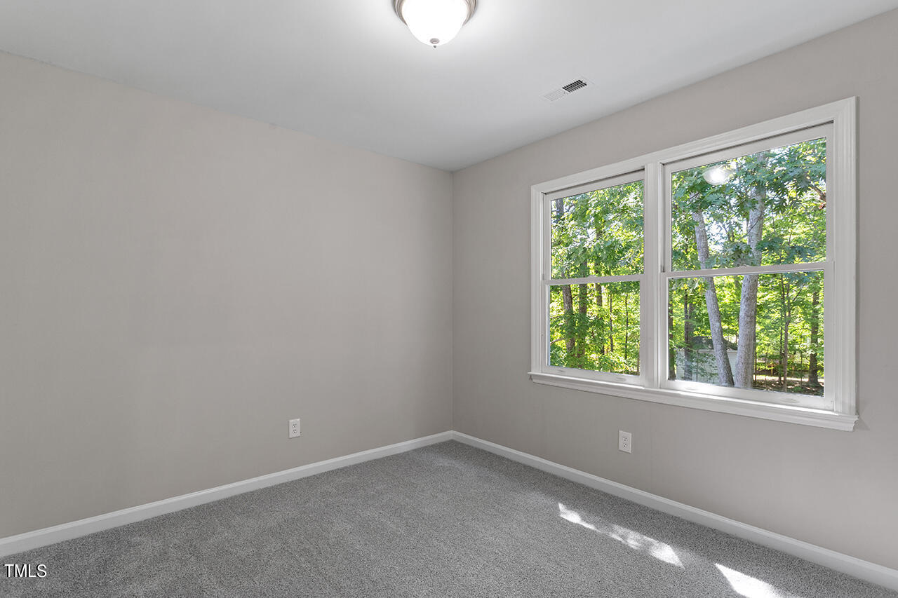 8 Warbler Lane Durham, NC 27712 - Photo 34 of 36 an empty room with a window