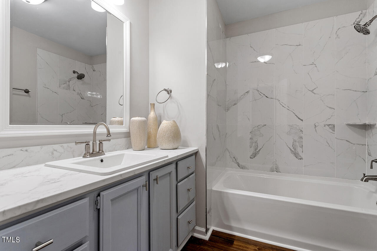 8 Warbler Lane Durham, NC 27712 - Photo 36 of 36 a bathroom with a granite countertop sink a toilet and bathtub