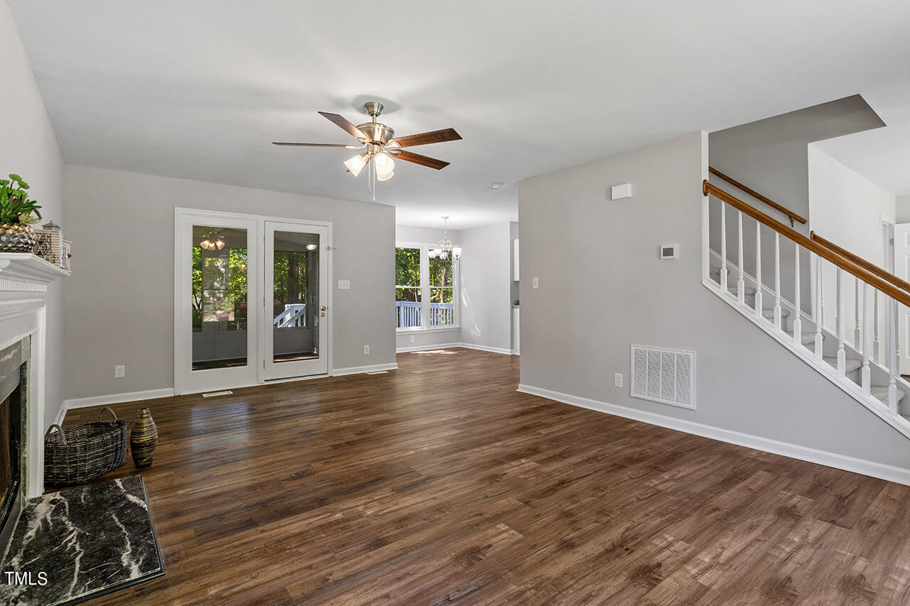 8 Warbler Lane Durham, NC 27712 - Photo 10 of 36 a view of an empty room with window and wooden floor