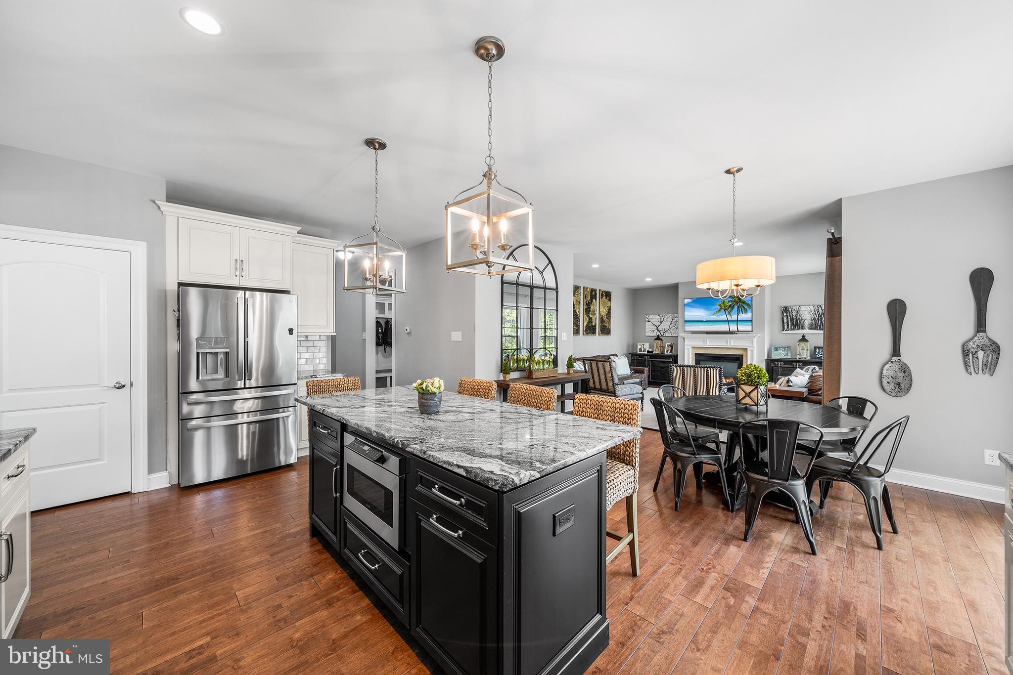 515 Old Eagle School Road Wayne, PA 19087 - Photo 12 of 40 a kitchen with stainless steel appliances granite countertop a stove and a refrigerator
