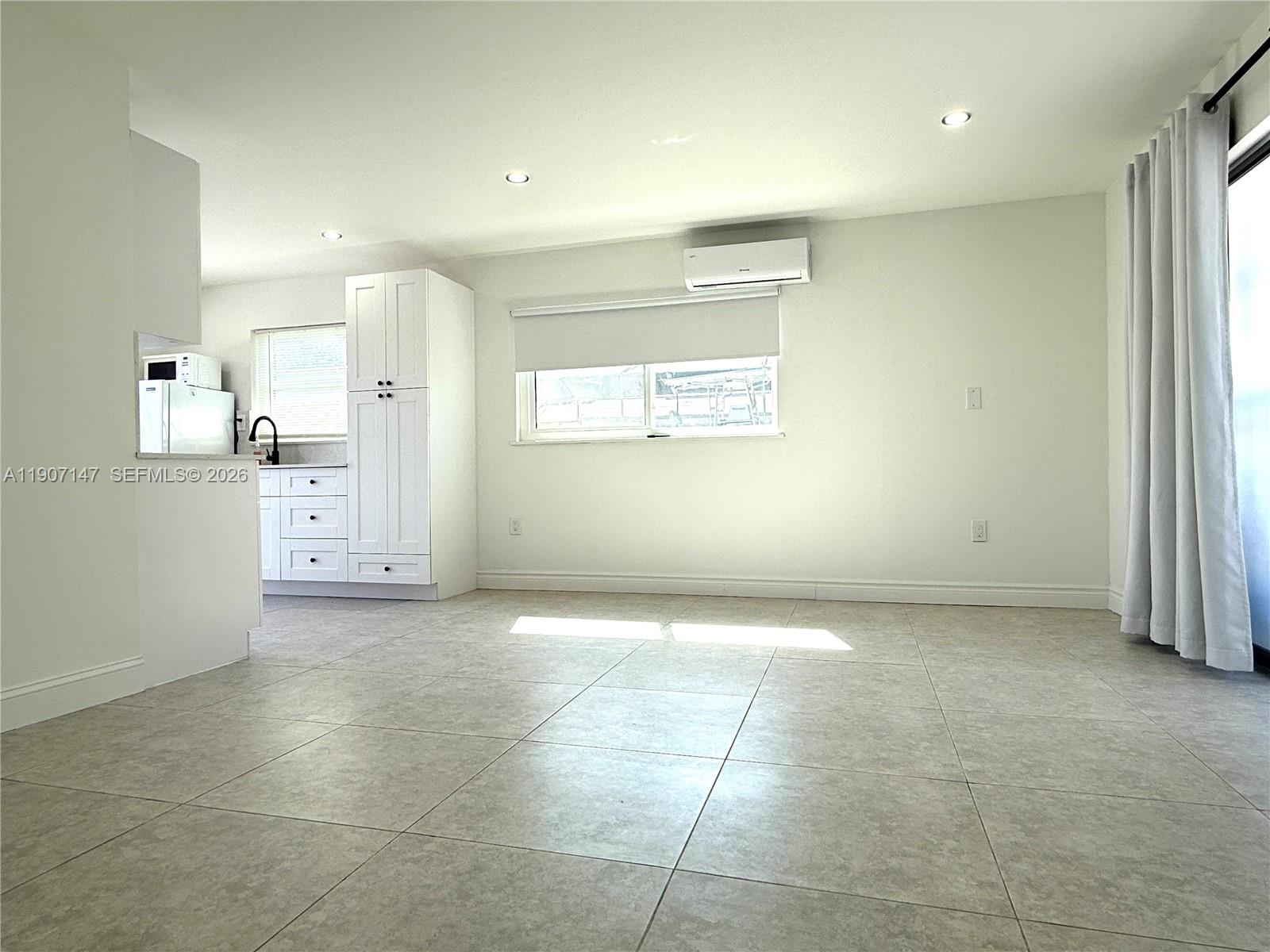 10040 Southwest 198th Street Cutler Bay, FL 33157 - Photo 11 of 13 a view of an empty room and window