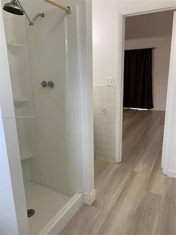 a front view of a house with swimming pool and porch