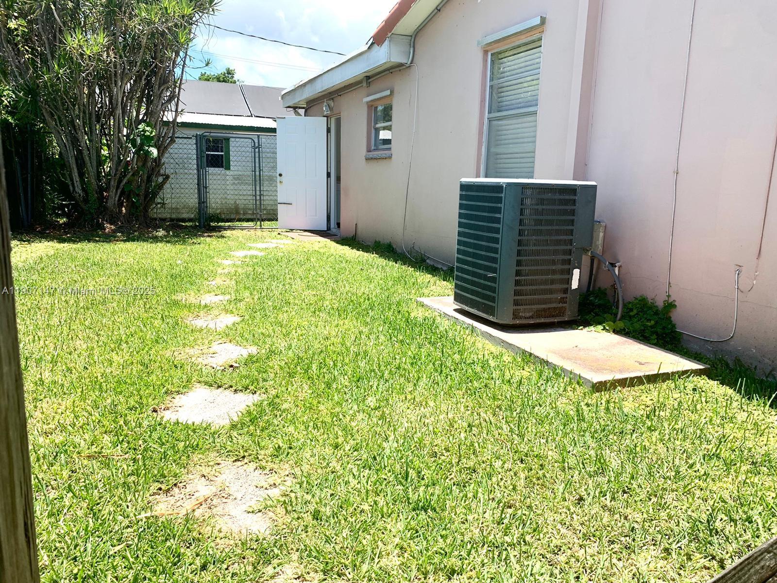 10040 Southwest 198th Street Cutler Bay, FL 33157 - Photo 17 of 17 a backyard of a house