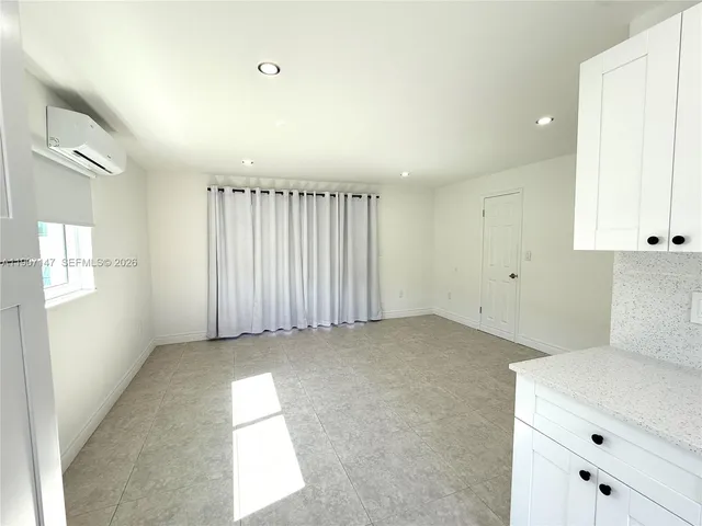 en empty room with windows