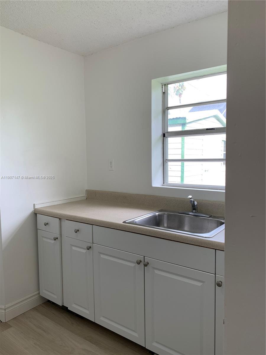 10040 Southwest 198th Street Cutler Bay, FL 33157 - Photo 8 of 17 a bathroom with a sink and a window