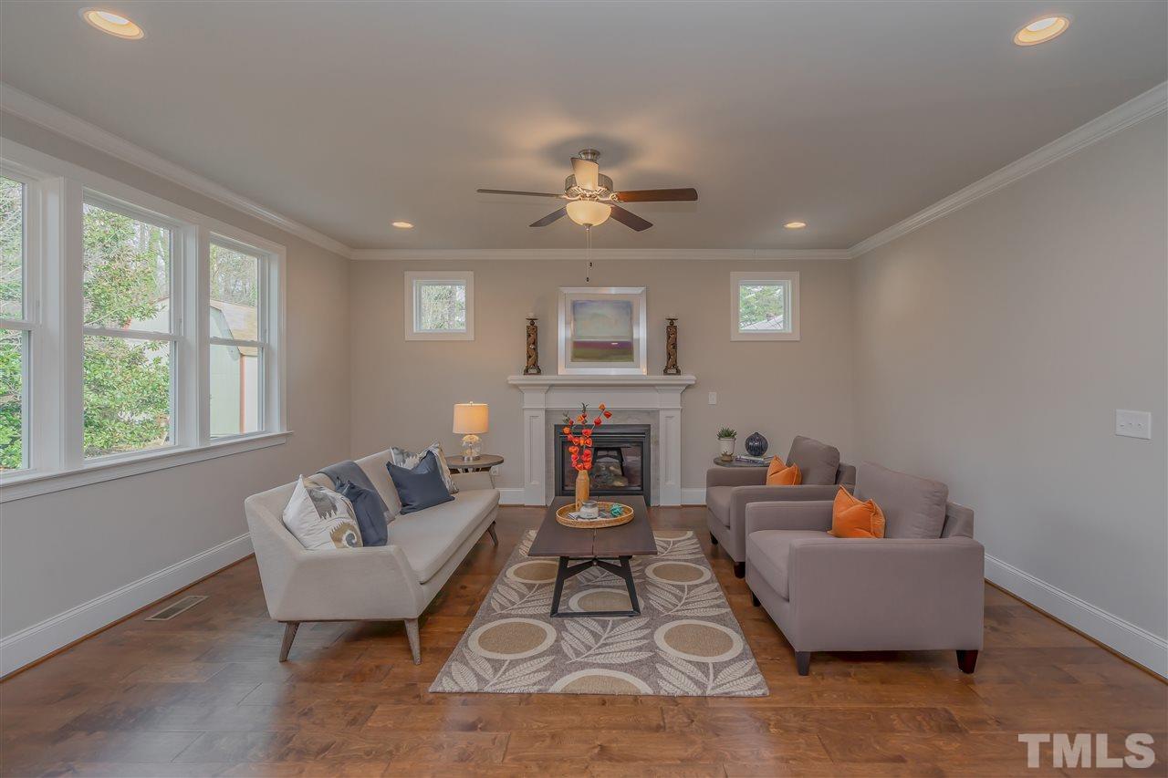 3911 Sue Lane Raleigh, NC 27604 - Photo 11 of 25 a living room with furniture fireplace and window