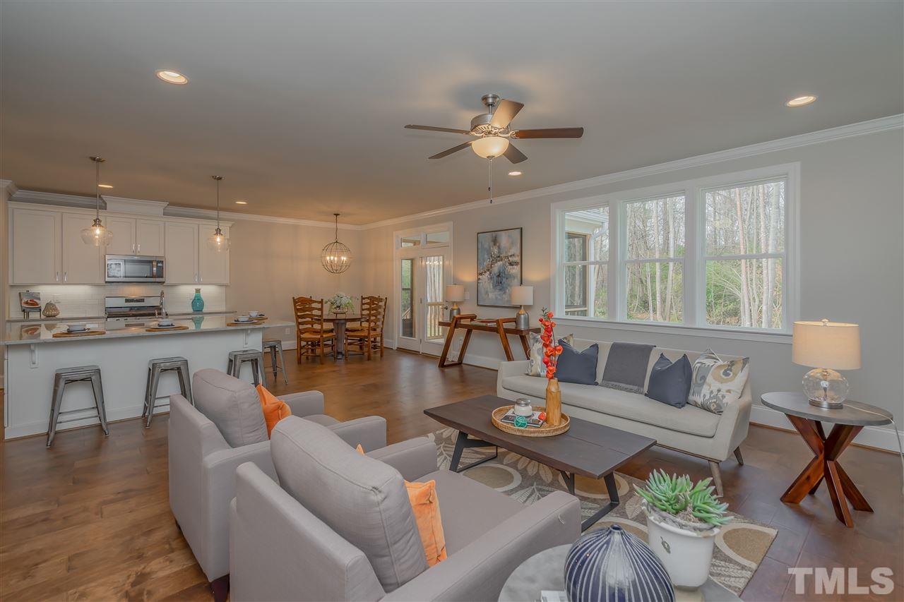 3911 Sue Lane Raleigh, NC 27604 - Photo 14 of 25 a living room with furniture kitchen view and a large window