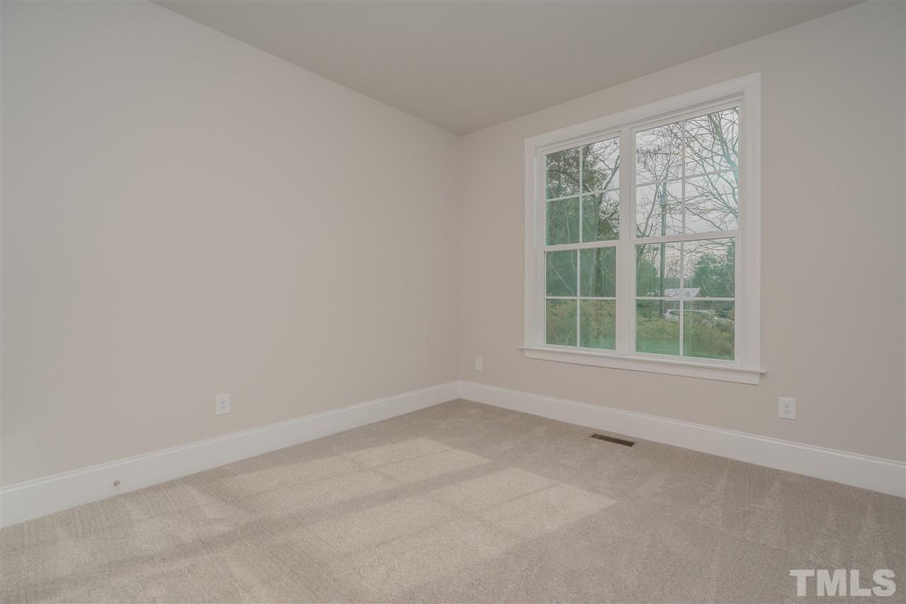 3911 Sue Lane Raleigh, NC 27604 - Photo 16 of 25 an empty room with a window