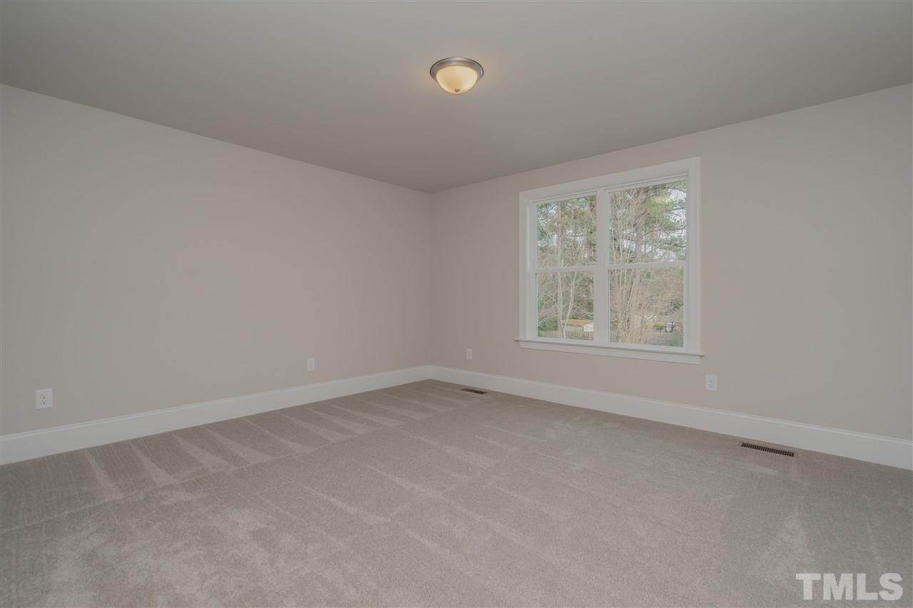 3911 Sue Lane Raleigh, NC 27604 - Photo 21 of 25 an empty room with a window