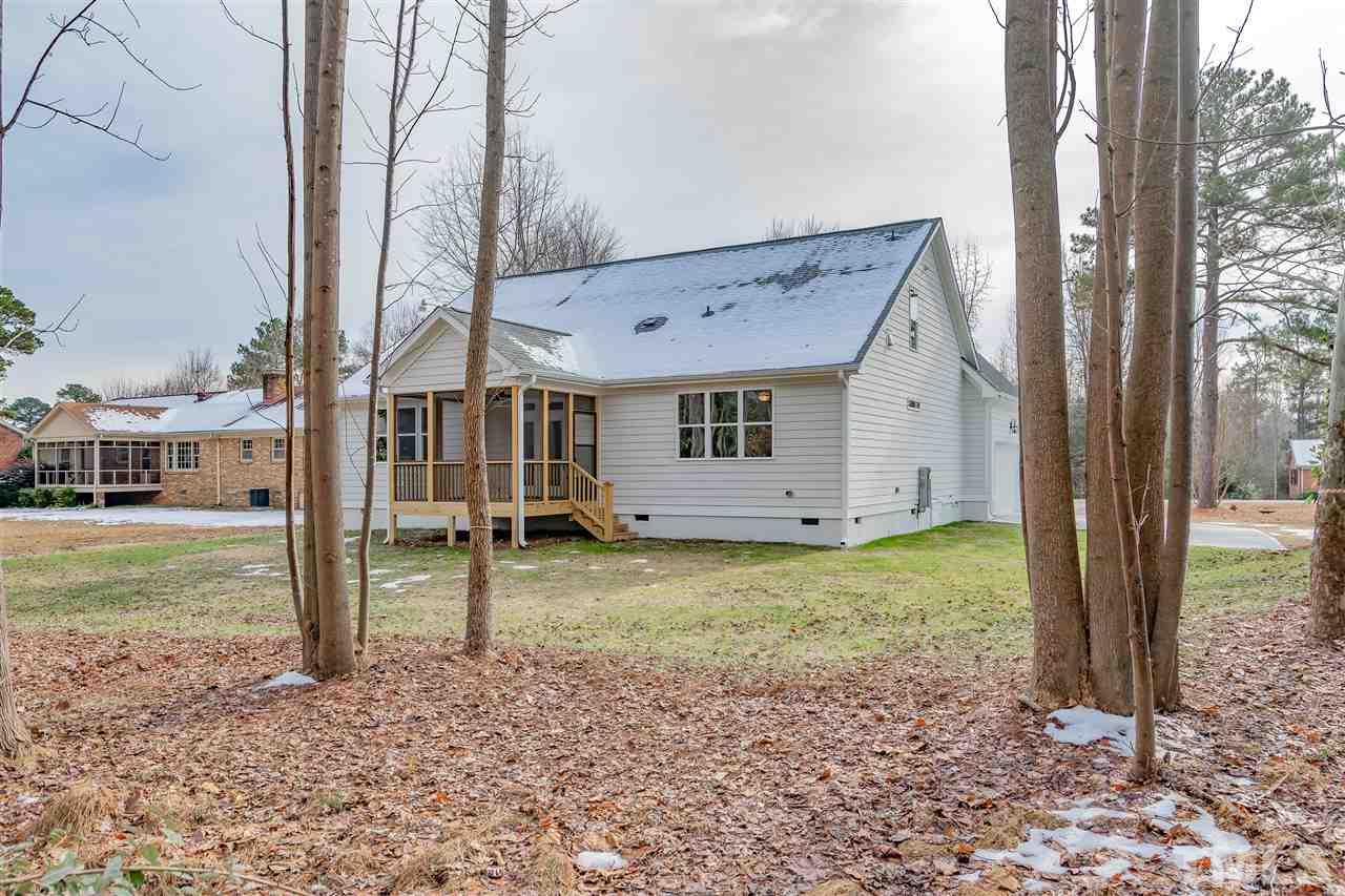 3911 Sue Lane Raleigh, NC 27604 - Photo 23 of 25 a view of a house with backyard and garden