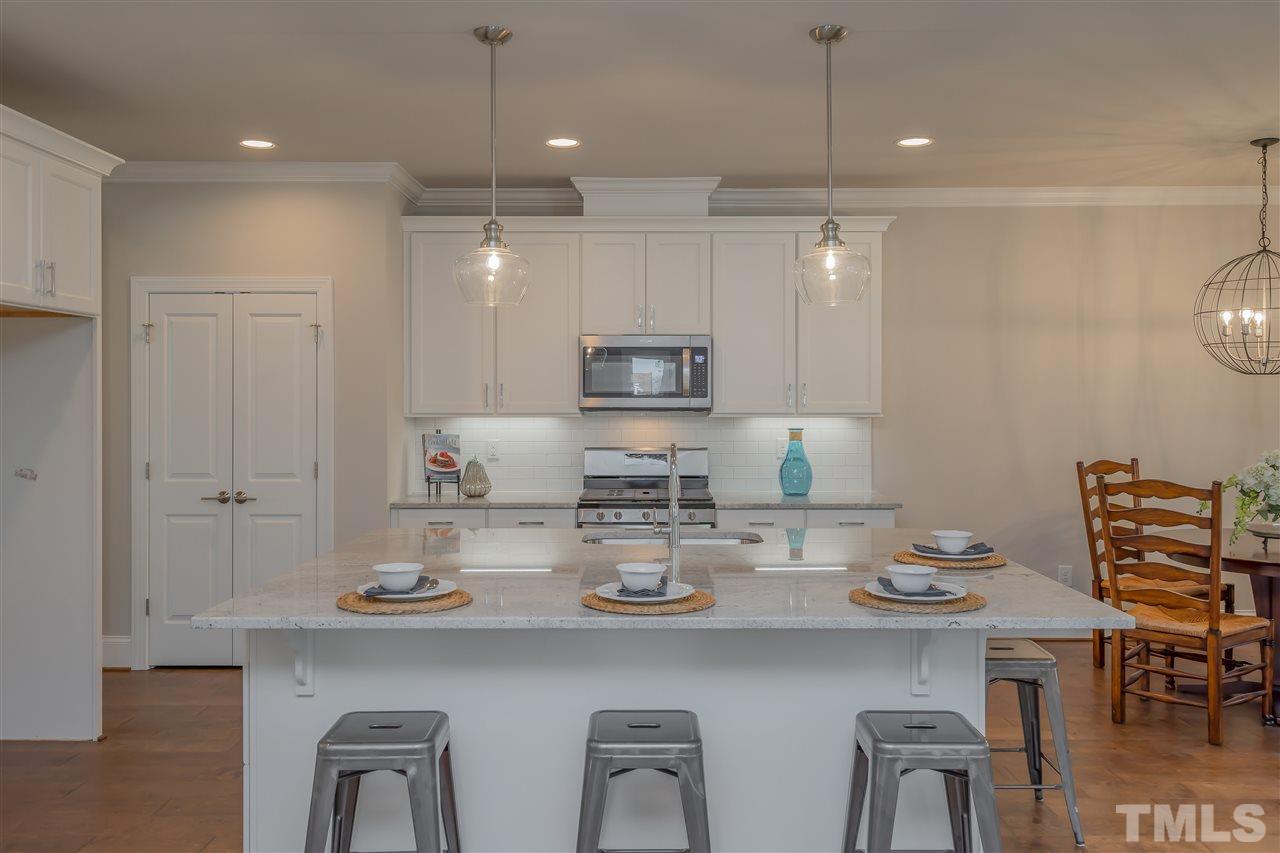 3911 Sue Lane Raleigh, NC 27604 - Photo 6 of 25 a kitchen with appliances and cabinets