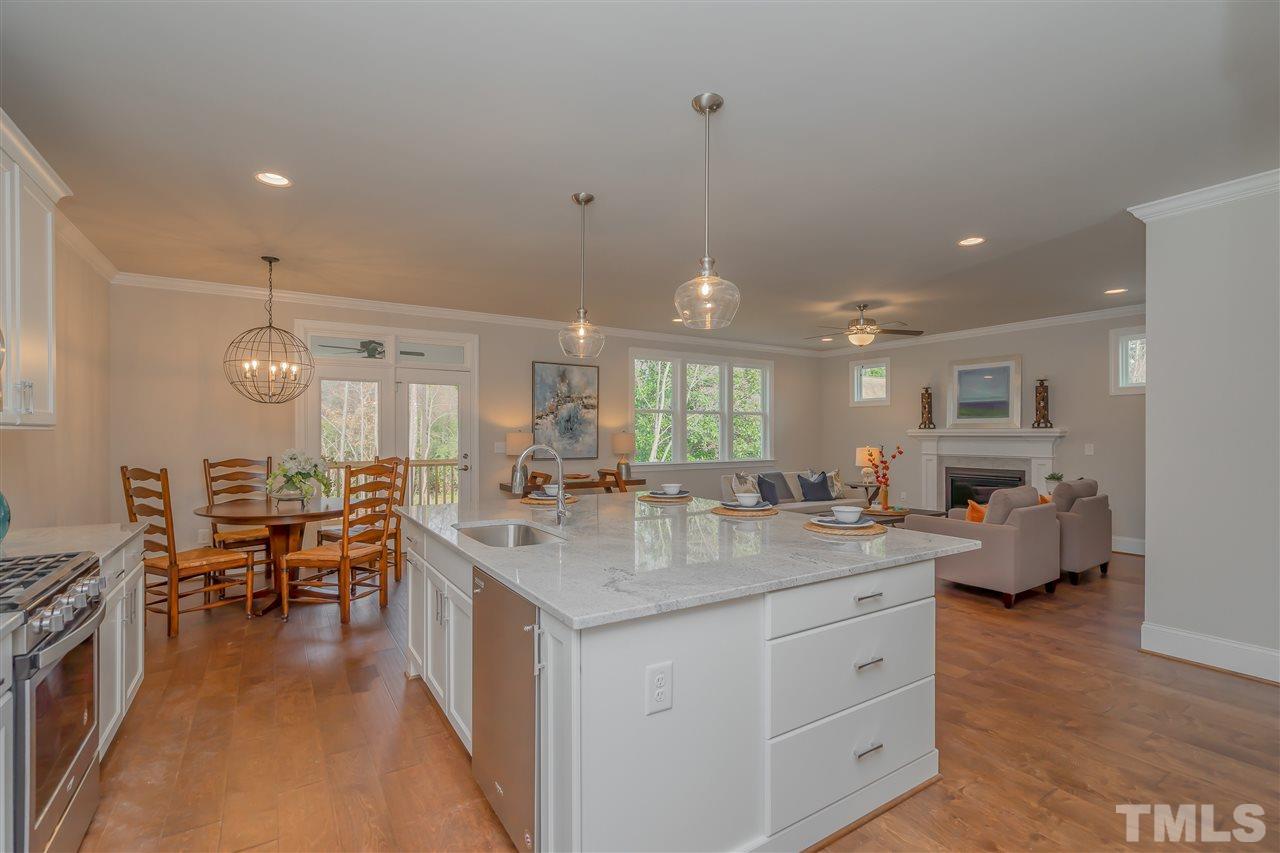 3911 Sue Lane Raleigh, NC 27604 - Photo 8 of 25 a kitchen with sink stove and view living room