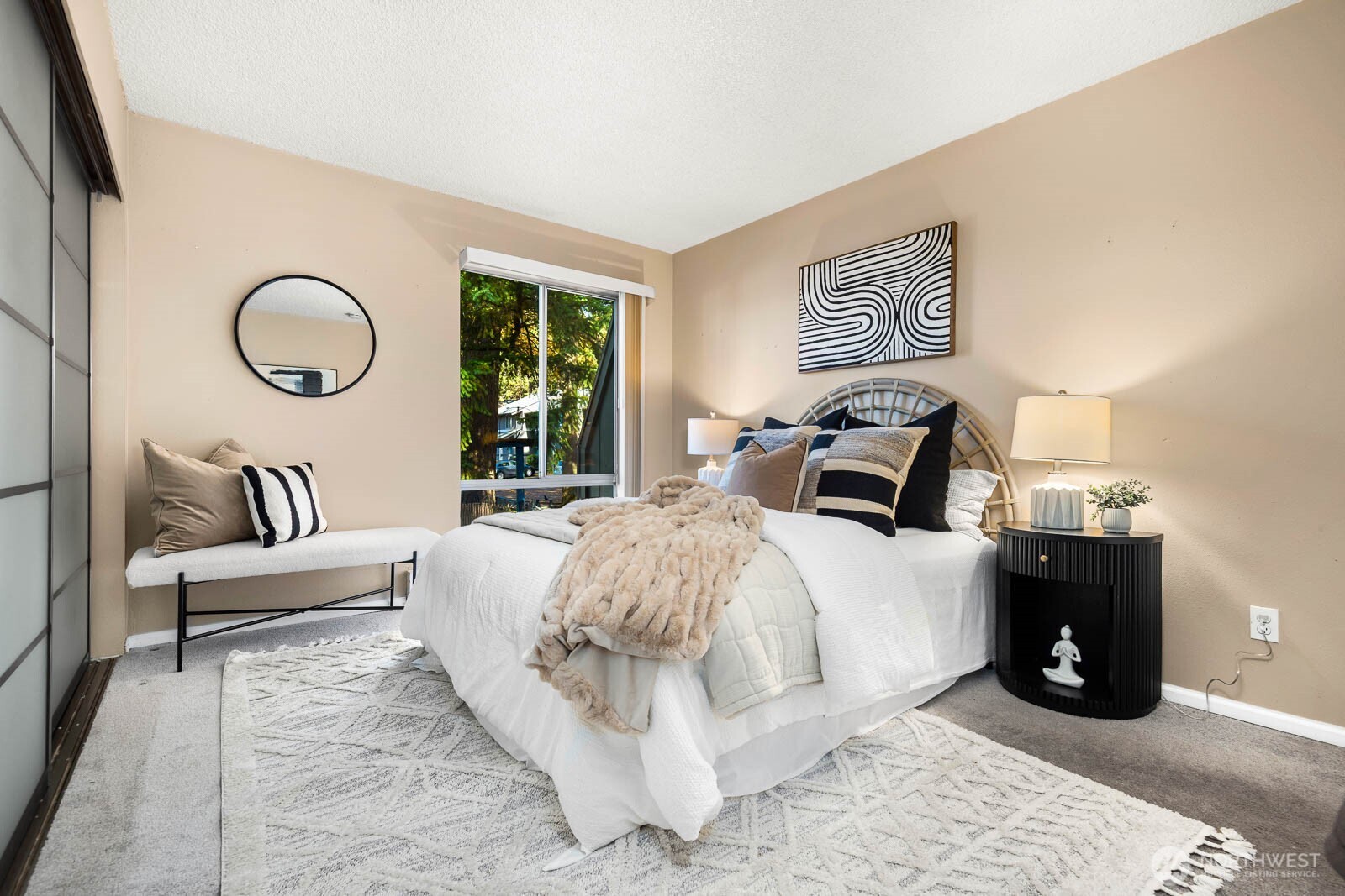 4823 180th Street Southwest, Unit H203 Lynnwood, WA 98037 - Photo 15 of 26 a spacious bedroom with a bed and a large window