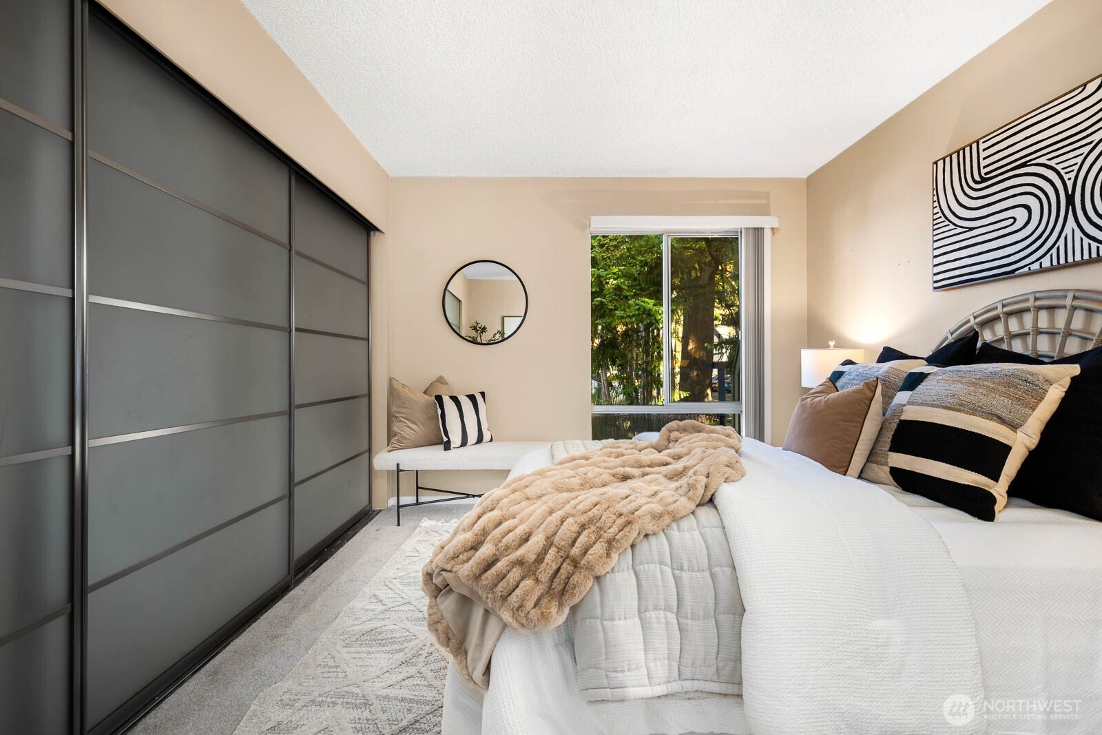 4823 180th Street Southwest, Unit H203 Lynnwood, WA 98037 - Photo 17 of 26 a bedroom with a bed and wooden floor