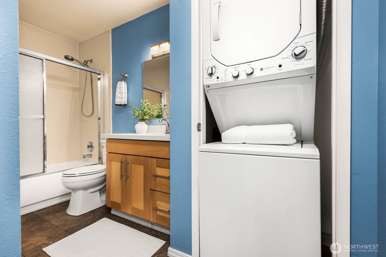 4823 180th Street Southwest, Unit H203 Lynnwood, WA 98037 - Photo 19 of 26 a bathroom with a toilet and a shower