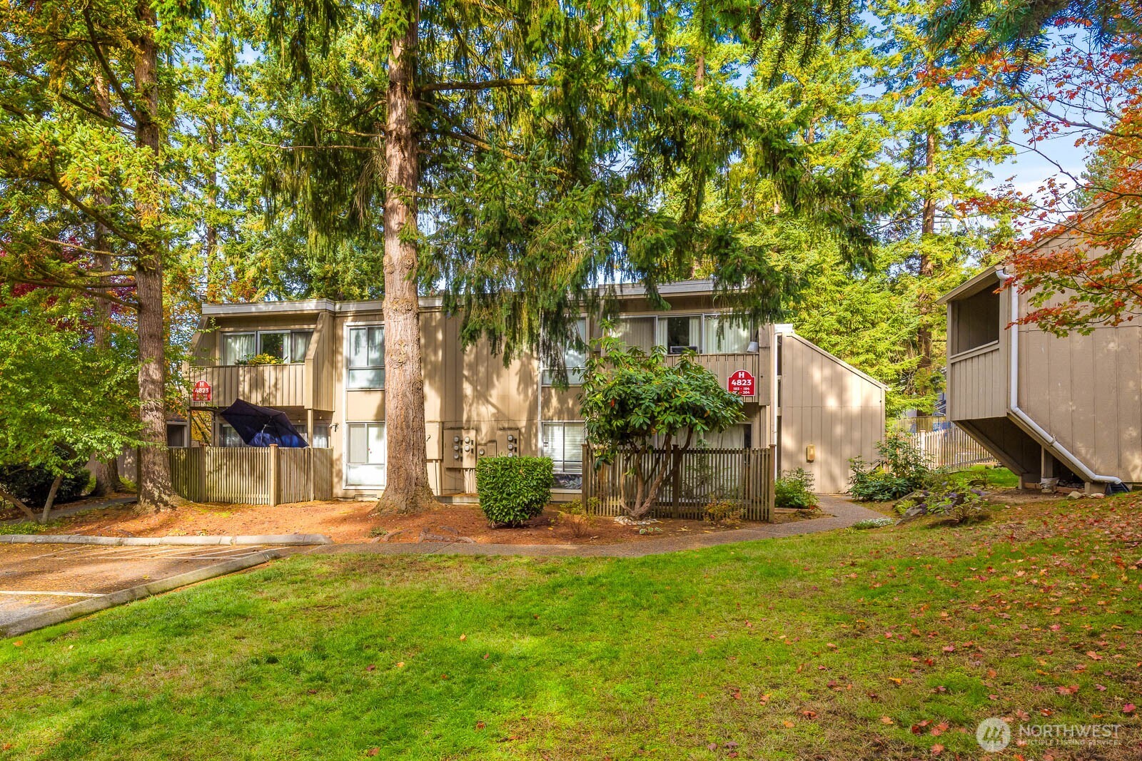 4823 180th Street Southwest, Unit H203 Lynnwood, WA 98037 - Photo 26 of 26 a view of a house with a tree in front of it