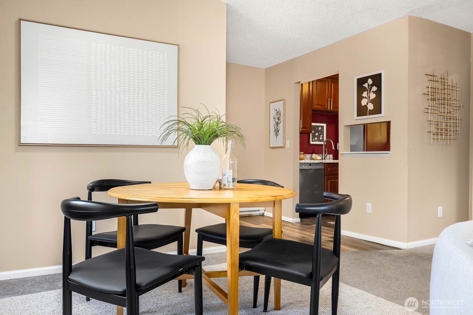 4823 180th Street Southwest, Unit H203 Lynnwood, WA 98037 - Photo 7 of 26 a table and chairs in a room