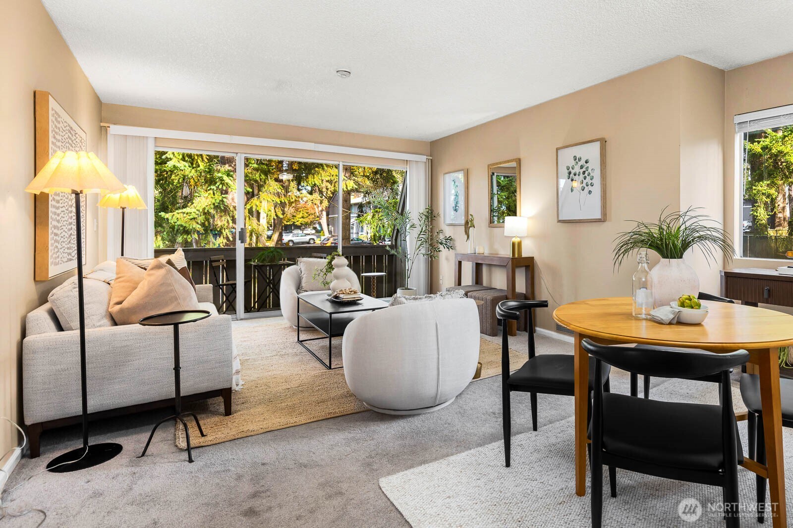 4823 180th Street Southwest, Unit H203 Lynnwood, WA 98037 - Photo 9 of 26 a living room with furniture and a large window