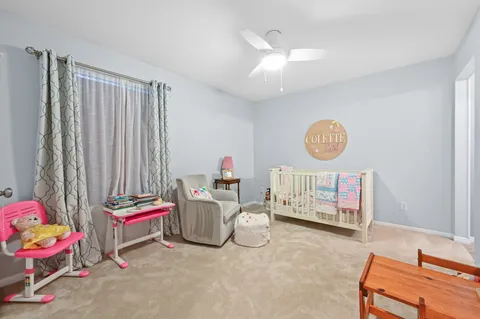 a bedroom with furniture and a wooden floor