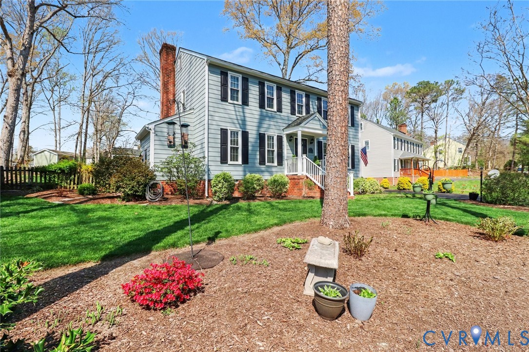 548 Glenmeadow Road Midlothian, VA 23114 - Photo 23 of 31 a front view of a house with a garden and plants