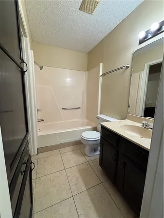 a bathroom with a double vanity sink and mirror