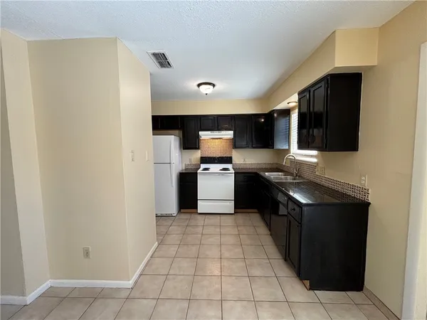 a view of a utility room with a sink