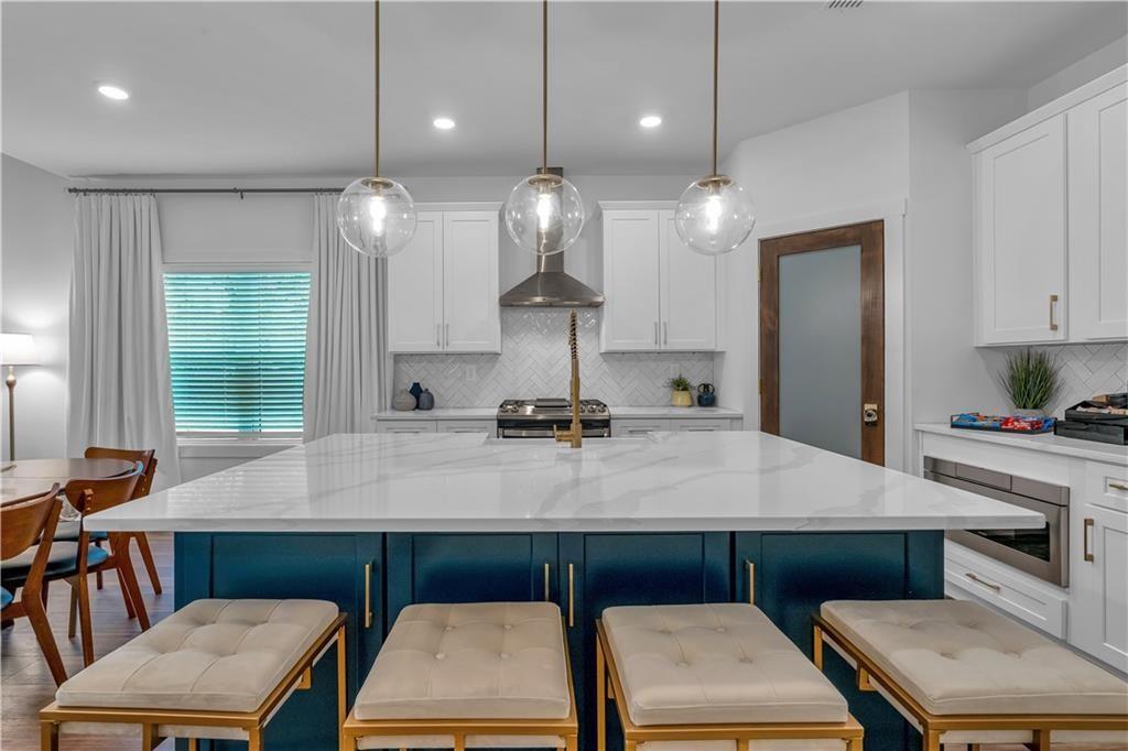44 Puckett Road Emerson, GA 30137 - Photo 12 of 39 a kitchen with a refrigerator a sink and a stove with wooden floor