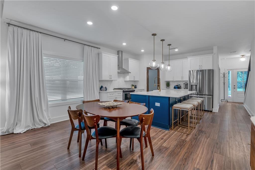 44 Puckett Road Emerson, GA 30137 - Photo 23 of 39 a view of a dining room with furniture and wooden floor
