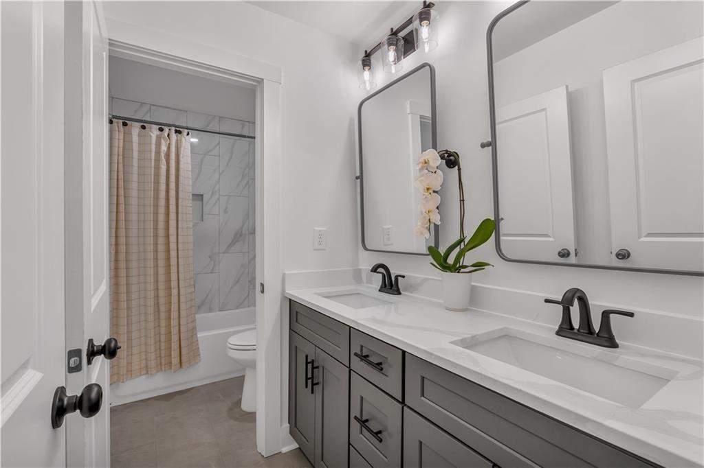 44 Puckett Road Emerson, GA 30137 - Photo 34 of 39 a bathroom with a sink and a mirror
