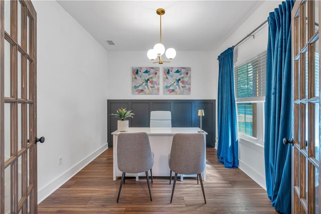 44 Puckett Road Emerson, GA 30137 - Photo 9 of 39 a view of a dining room with furniture wooden floor and a chandelier