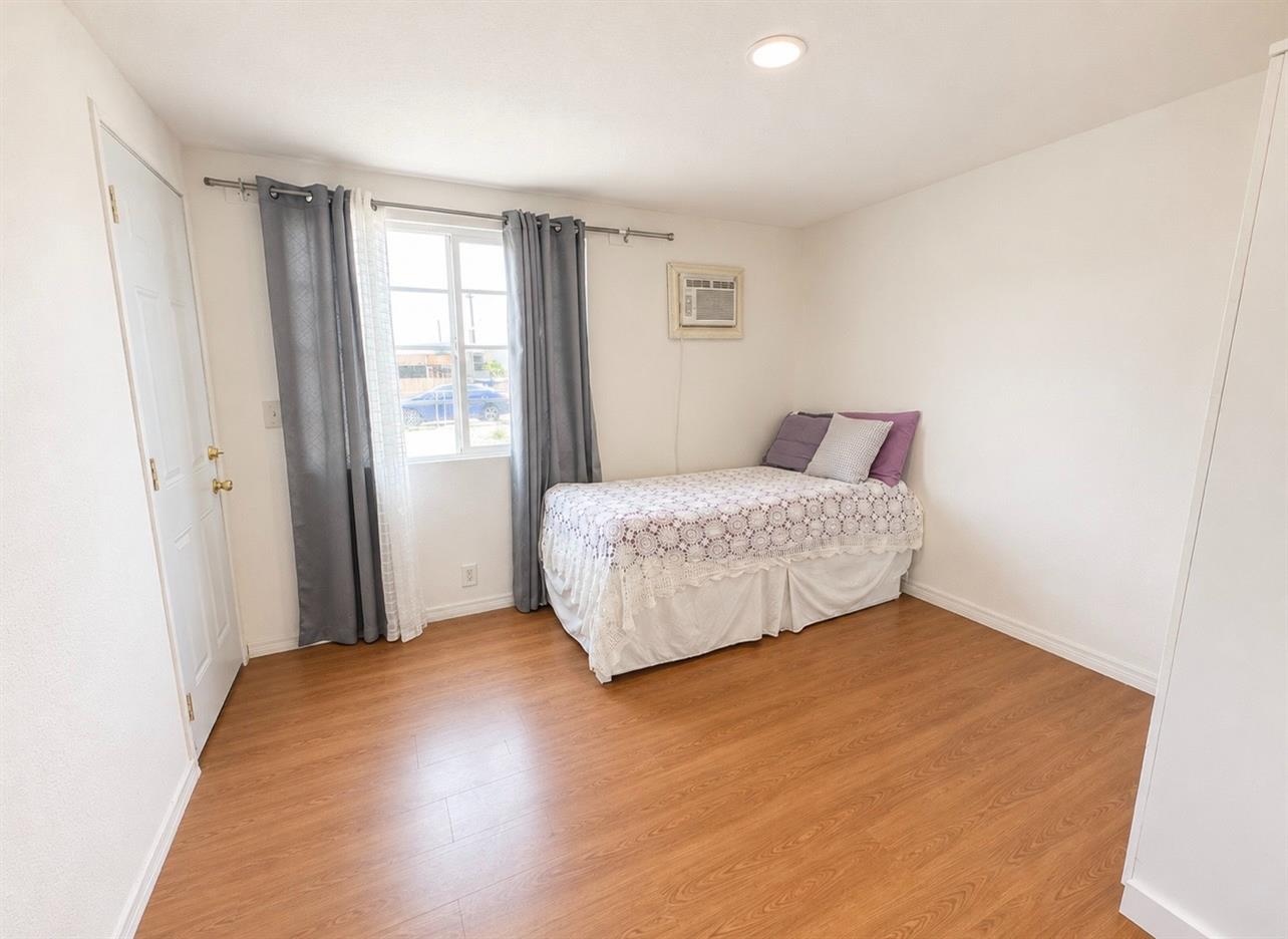5000 Pierce Road, Unit 32 Bakersfield, CA 93308 - Photo 10 of 15 a bedroom with a bed and a window