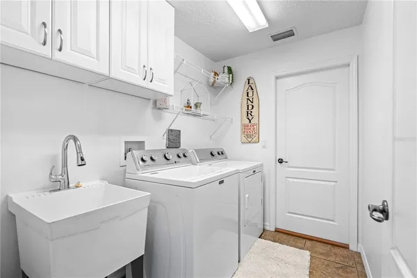 a kitchen with stainless steel appliances granite countertop a sink and cabinets