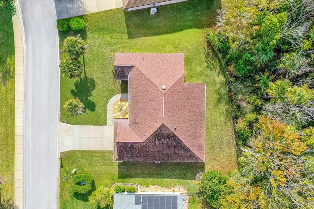an aerial view of house with yard swimming pool and outdoor seating
