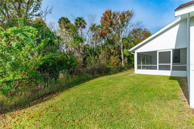 a view of backyard with green space