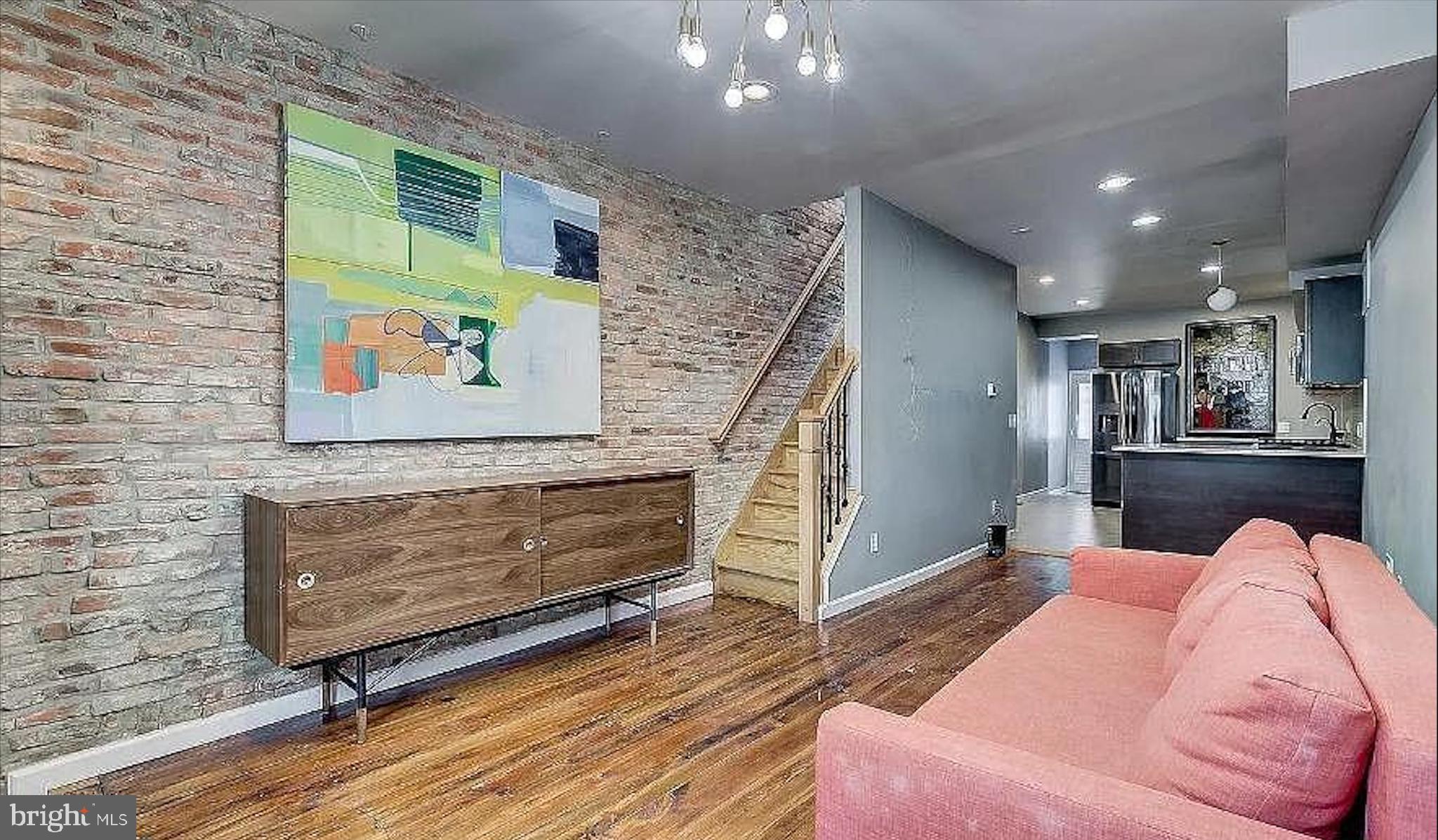 150 North Curley Street Baltimore, MD 21224 - Photo 1 of 10 a living room with furniture and a wooden floor