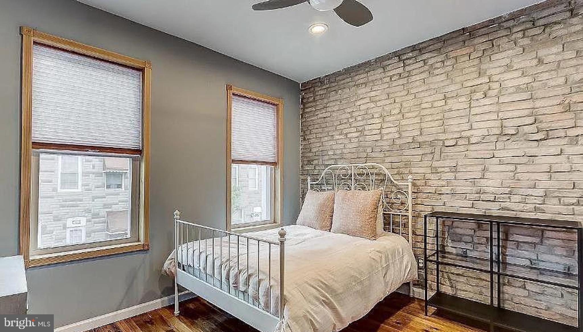 150 North Curley Street Baltimore, MD 21224 - Photo 8 of 10 a bedroom with a bed and a window